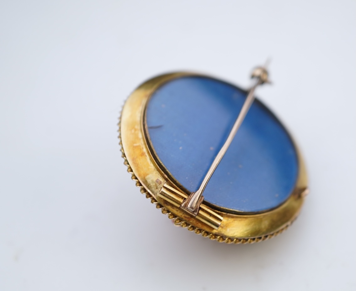 A Victorian gold and coral brooch, late 19th century
